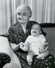 Close-up of a grandmother sitting on a couch with her grandson on her lap Poster Print - Item # VARSAL25520073