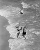 High angle view of a young couple playing with a beach ball on the beach Poster Print - Item # VARSAL25526836
