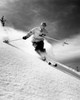 Low angle view of a young man skiing downhill Poster Print - Item # VARSAL25515772