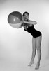 Portrait of young woman with beach ball Poster Print - Item # VARSAL255416821