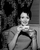 Young woman enjoying cup of tea Poster Print - Item # VARSAL255417741