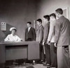 Teenage boys standing in a row beside a nurse's desk Poster Print - Item # VARSAL25526452