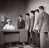 Teenage boys standing in a row beside a nurse's desk Poster Print - Item # VARSAL25526452