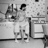 Mother embracing children in kitchen Poster Print - Item # VARSAL255417656