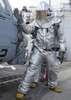 Arabian Sea, February 7, 2012 - Hull Maintenance Technician checks an SH-60B Sea Hawk helicopter for hot spots during a flight deck recovery drill aboard the guided-missile destroyer USS Halsey Poster Print - Item # VARPSTSTK105275M