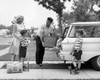 Parent and children loading luggage into car Poster Print - Item # VARSAL2554668