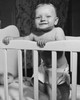 Baby standing in a crib Poster Print - Item # VARSAL2559632B