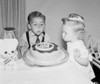Children blowing candles on birthday cake Poster Print - Item # VARSAL255725