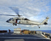 Atlantic Ocean, December 14, 2006 - An MH-60S Seahawk helicopter prepares to deliver ammunition to flight deck of USS Theodore Roosevelt Poster Print - Item # VARPSTSTK101945M