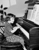 Girl playing a piano Poster Print - Item # VARSAL25514253