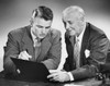 Close-up of two businessmen reading a file Poster Print - Item # VARSAL25523380
