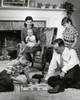 Parents and their children sitting in the living room Poster Print - Item # VARSAL2553177