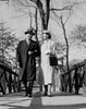 Couple walking arm in arm in park Poster Print - Item # VARSAL255422201