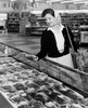 Young woman shopping in the meat case Poster Print - Item # VARSAL2551980