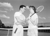 Young couple talking over tennis net Poster Print - Item # VARSAL255420331