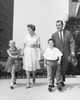 Mature couple walking with their son and daughter Poster Print - Item # VARSAL25519338B
