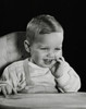 Close-up of a baby sitting in a high chair and smiling Poster Print - Item # VARSAL2559692C
