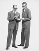 Two businessmen reading newspaper Poster Print - Item # VARSAL25548046