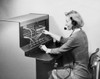 Female switchboard operator operating a telephone switchboard Poster Print - Item # VARSAL25516909
