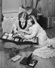 High angle view of two girls looking at a photo album Poster Print - Item # VARSAL25516479