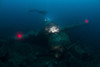 Japanese Navy Seaplane wreck lit by HMI lights with diver hovering above and red lights marking wing tips, Palau, Micronesia Poster Print - Item # VARPSTMME400620U