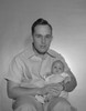 Portrait of a father holding his baby Poster Print - Item # VARSAL2559770
