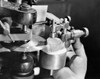 Close-up of a man's hand adjusting a diamond cutter machine Poster Print - Item # VARSAL25520920