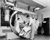 Male radiologist with a female radiologist taking an x-ray of a patient Poster Print - Item # VARSAL25533909