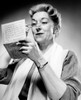 Studio shot of woman reading letter Poster Print - Item # VARSAL25548975