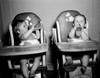 Two babies sitting in high chairs drinking from baby bottles Poster Print - Item # VARSAL2559570A