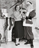 Mid adult man dressed as Santa Claus standing with his wife and son Poster Print - Item # VARSAL2554495