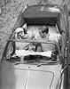 High angle view of a young couple sitting in a car and reading a map Poster Print - Item # VARSAL25550050