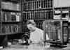 Scientist looking through a microscope in a chemical research laboratory Poster Print - Item # VARSAL2556117