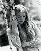 Close-up of a teenage girl holding a tree trunk thinking Poster Print - Item # VARSAL2553895