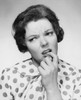 Close-up of a mid adult woman with her finger in her mouth Poster Print - Item # VARSAL25511388