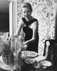 Mid adult woman setting the dining table and smiling Poster Print - Item # VARSAL25541883