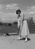 Young woman playing golf Poster Print - Item # VARSAL255416722
