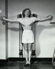 Young woman exercising in a gym and smiling Poster Print - Item # VARSAL25540092 Young woman exercising in a gym and smiling Poster Print - Item # VARSAL25540092