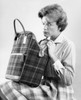 Woman checking bag with frowning forehead Poster Print - Item # VARSAL25549142