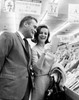 Mid adult couple shopping for greeting cards in a store Poster Print - Item # VARSAL2551313