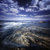 Rocky shore and tranquil sea against cloudy sky, Portoscuso, Sardinia, Italy. Poster Print - Item # VARPSTEVK200076S