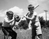 Two boys playing baseball in field Poster Print - Item # VARSAL2559940