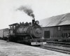 Rear view of a man standing beside a steam train engine at a railroad station Poster Print - Item # VARSAL9901088