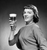 Portrait of young woman holding glass of beer Poster Print - Item # VARSAL2554235