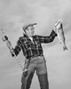 Mid adult man holding dead fish and fishing pole Poster Print - Item # VARSAL2553681