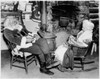 Side profile of Santa Claus sitting with a senior woman near a fireplace Poster Print - Item # VARSAL255690