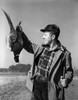 Close-up of a hunter holding a dead bird Poster Print - Item # VARSAL25524404B