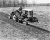 Farmer plowing a field with a tractor Poster Print - Item # VARSAL25530435