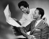 Side profile of a young couple reading a map Poster Print