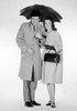 Studio portrait of couple under umbrella Poster Print - Item # VARSAL255417654